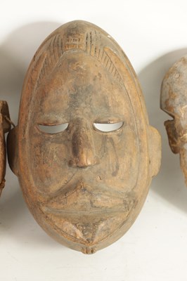 Lot 168 - A COLLECTION OF FOUR TRIBAL AFRICAN FACE MASKS