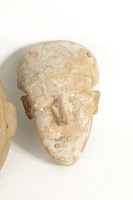 Lot 168 - A COLLECTION OF FOUR TRIBAL AFRICAN FACE MASKS