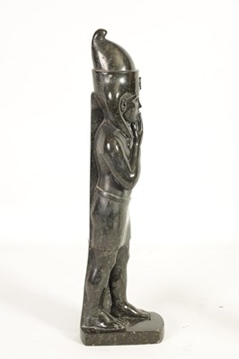 Lot 523 - AN UNUSUAL CARVED MARBLE EGYPTIAN STYLE FIGURE OF A STANDING MAN