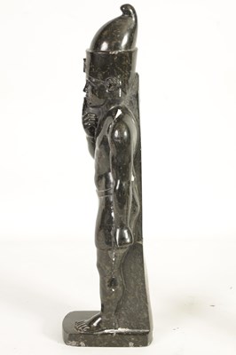 Lot 523 - AN UNUSUAL CARVED MARBLE EGYPTIAN STYLE FIGURE OF A STANDING MAN