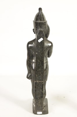 Lot 523 - AN UNUSUAL CARVED MARBLE EGYPTIAN STYLE FIGURE OF A STANDING MAN