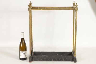 Lot 440 - A LATE 19TH CENTURY BRASS AND CAST IRON STICK STAND