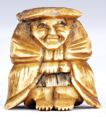 Lot 105 - A JAPANESE BONE NETSUKE of an oriental man...