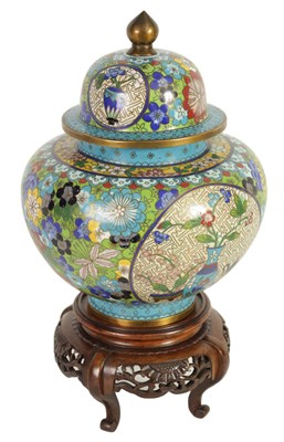 Lot 234 - A LATE 19TH CENTURY CHINESE CLOISONNÉ ENAMEL JAR AND COVER ON CARVED WOOD STAND