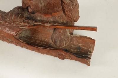 Lot 871 - A 19TH CENTURY BLACK FOREST CARVED LINDENWOOD INKWELL FORMED AS DOG RESTING ON A LOG