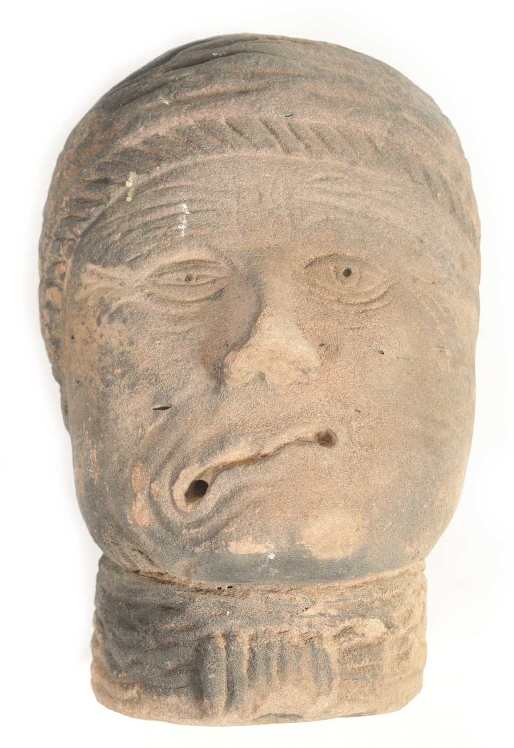 Lot 517 - AN EARLY EASTERN CARVED RED SANDSTONE HEAD