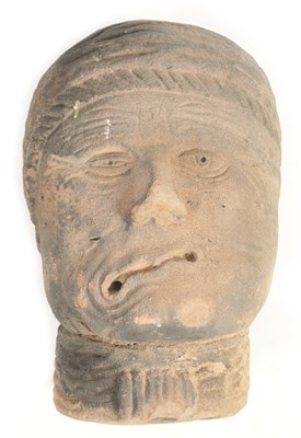 Lot 517 - AN EARLY EASTERN CARVED RED SANDSTONE HEAD