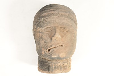 Lot 517 - AN EARLY EASTERN CARVED RED SANDSTONE HEAD