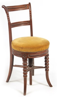 Lot 1059 - AN EARLY 19TH CENTURY MAHOGANY REVOLVING MUSIC CHAIR