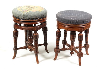 Lot 1074 - TWO 19TH CENTURY CIRCULAR WALNUT REVOLVING PIANO STOOLS