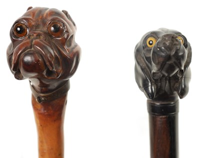 Lot 473 - TWO 19TH CENTURY CARVED DOGS HEAD WALKING CANES