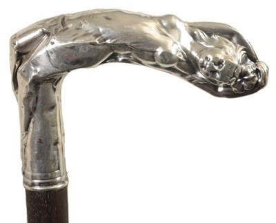 Lot 465 - AN ART NOUVEAU SILVER MOUNTED WALKING CANE DEPICTING A RECLINING NUDE FEMALE TO THE HANDLE