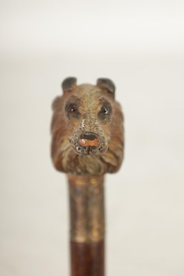 Lot 457 - TWO EARLY 20TH CENTURY DOG’S HEAD HANDLED WALKING STICKS