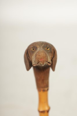 Lot 457 - TWO EARLY 20TH CENTURY DOG’S HEAD HANDLED WALKING STICKS