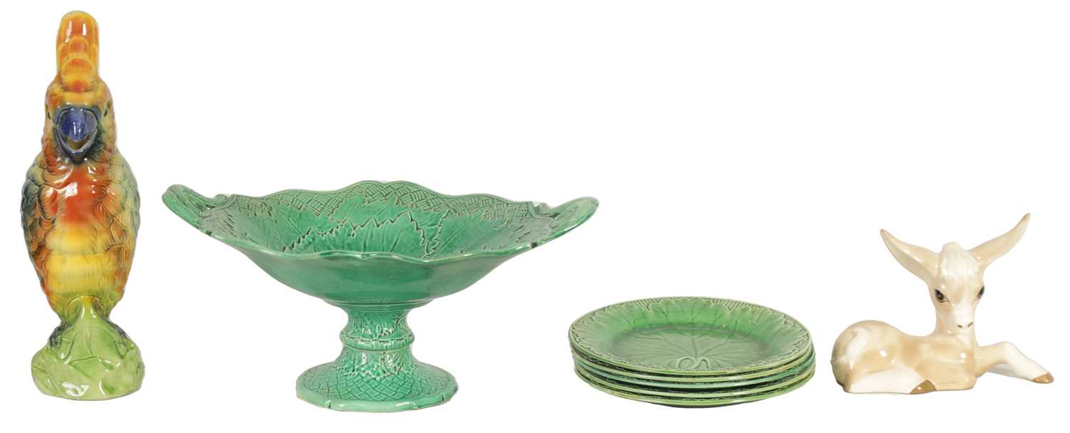 Lot 75 - FIVE 19TH CENTURY WEDGWOOD GREEN LEAF MOULDED PLATES, A SIMALR LARGE TWO HANDLED FOOTED TAZZA, A ST CLEMENT FRANCE PARROT JUG AND A POTTERY BAMBI FIGURE