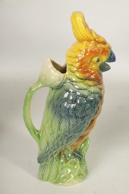 Lot 75 - FIVE 19TH CENTURY WEDGWOOD GREEN LEAF MOULDED PLATES, A SIMALR LARGE TWO HANDLED FOOTED TAZZA, A ST CLEMENT FRANCE PARROT JUG AND A POTTERY BAMBI FIGURE