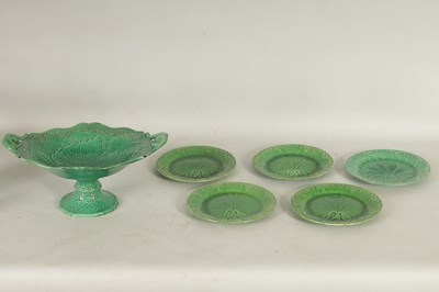 Lot 75 - FIVE 19TH CENTURY WEDGWOOD GREEN LEAF MOULDED PLATES, A SIMALR LARGE TWO HANDLED FOOTED TAZZA, A ST CLEMENT FRANCE PARROT JUG AND A POTTERY BAMBI FIGURE