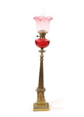 Lot 635 - A 19TH CENTURY BRASS AND CRANBERRY GLASS OIL LAMP