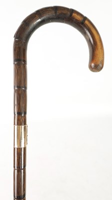 Lot 693 - A LATE 19TH CENTURY PALM WOOD WLKING STICK