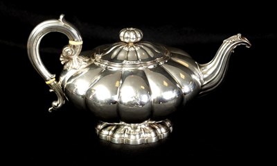 Lot 324 - A GEORGE IV FOOTED MELON SHAPED SILVER TEA POT