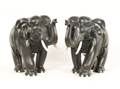 Lot 113 - A PAIR OF LATE 19TH CENTURY ANGLO-INDIAN EBONY AND IVORY ELEPHANTS