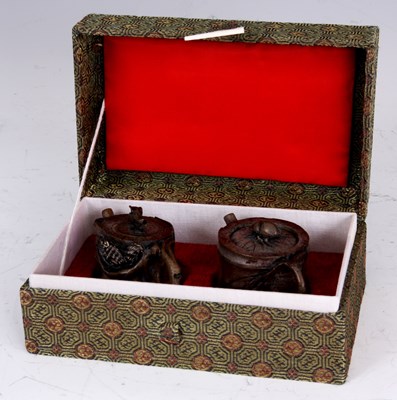 Lot 147 - TWO JAPANESE CERAMIC MINIATURE TEAPOTS formed...