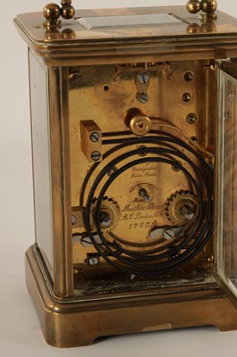 Lot 1062 - A MATTHEW NORMAN BRASS STRIKING CARRIAGE CLOCK