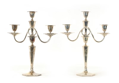 Lot 406 - A PAIR OF GEORGE VI ART DECO DESIGN SILVER CANDELABRA