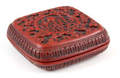 Lot 157 - A SQUARE CHINESE CARVED CINNABAR PILL BOX with...