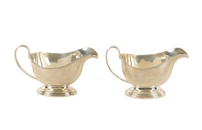 Lot 445 - A PAIR OF ELIZABETH II SILVER CREAM JUGS