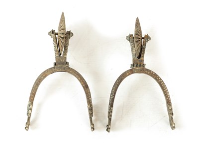 Lot 637 - A PAIR OF 19TH CENTURY SOUTH AMERICAN CAST IRON AND STEEL INLAID ROWEL SPURS