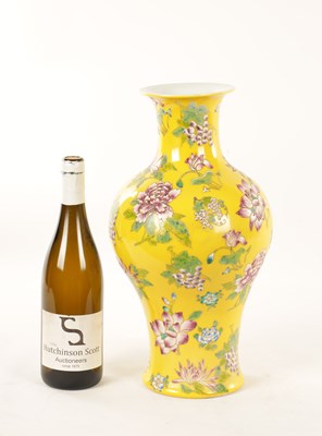 Lot 121 - A CHINESE FAMILLE ROSE YELLOW GROUND VASE