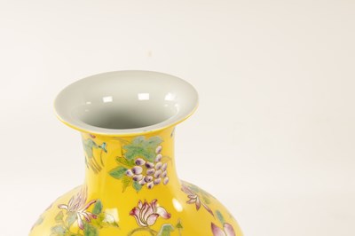 Lot 121 - A CHINESE FAMILLE ROSE YELLOW GROUND VASE