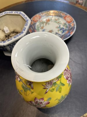 Lot 121 - A CHINESE FAMILLE ROSE YELLOW GROUND VASE