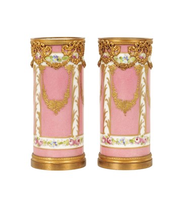 Lot 63 - A PAIR OF 19TH CENTURY SEVRES AND GILT METAL MOUNTED SPILL VASES