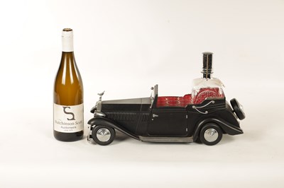 Lot 673 - A 20TH CENTURY BLACK PAINTED NOVELTY MUSICAL ROLLS ROYCE TABLE LIQUEUR DECANTER SET