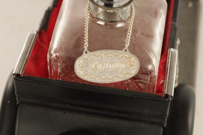 Lot 673 - A 20TH CENTURY BLACK PAINTED NOVELTY MUSICAL ROLLS ROYCE TABLE LIQUEUR DECANTER SET