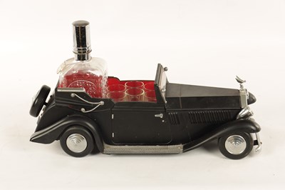 Lot 673 - A 20TH CENTURY BLACK PAINTED NOVELTY MUSICAL ROLLS ROYCE TABLE LIQUEUR DECANTER SET