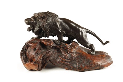 Lot 166 - A JAPANESE MEIJI PERIOD PATINATED BRONZE SCULPTURE OF A LION