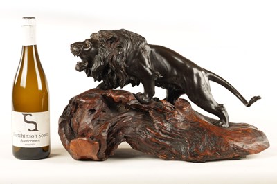 Lot 166 - A JAPANESE MEIJI PERIOD PATINATED BRONZE SCULPTURE OF A LION