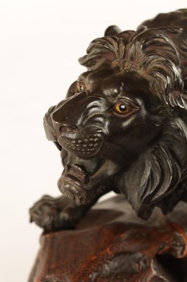 Lot 166 - A JAPANESE MEIJI PERIOD PATINATED BRONZE SCULPTURE OF A LION