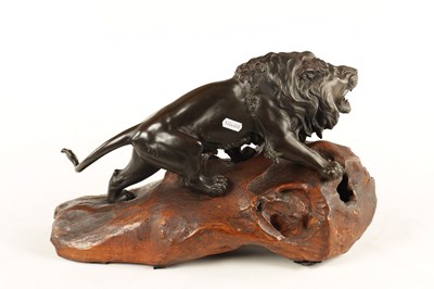 Lot 166 - A JAPANESE MEIJI PERIOD PATINATED BRONZE SCULPTURE OF A LION