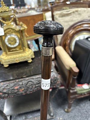Lot 572 - A 19TH CENTURY CARVED EBONY AND CALAMANDA WALKING CANE