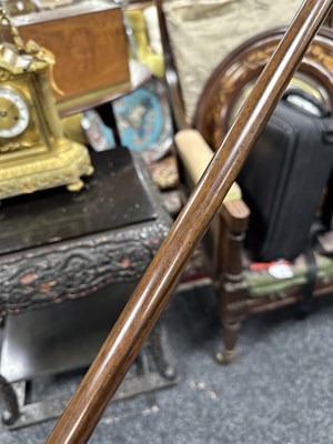Lot 572 - A 19TH CENTURY CARVED EBONY AND CALAMANDA WALKING CANE