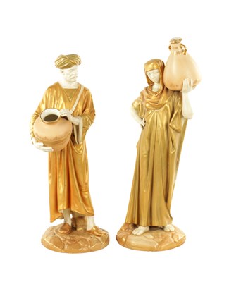 Lot 32 - A LARGE PAIR OF ROYAL WORCESTER STANDING FIGURES OF EASTERN WATER CARRIERS AFTER JAMES HADLEY