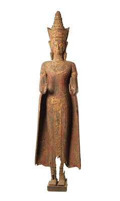 Lot 123 - AN EARLY TIBETAN LIFE-SIZE GILT AND RED LACQUER CARVED STANDING FIGURE OF A BUDDHA