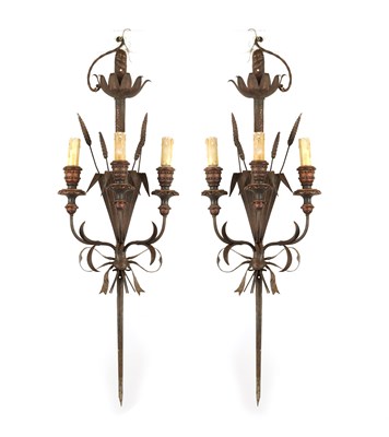 Lot 618 - A DECORATIVE PAIR OF EALRY 20TH CENTURY FRENCH IRONWORK THREE BRANCH WALL LIGHTS