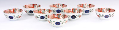 Lot 203 - A SET OF EIGHT CHINESE RED FAMILLE ROSE RICE...