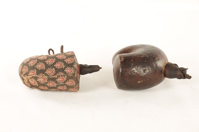 Lot 493 - AN UNUSUAL PAIR OF CARVED POWDER FLASKS