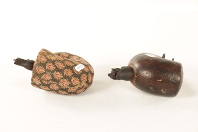 Lot 493 - AN UNUSUAL PAIR OF CARVED POWDER FLASKS